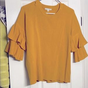 A yellow/cannery colored sweater